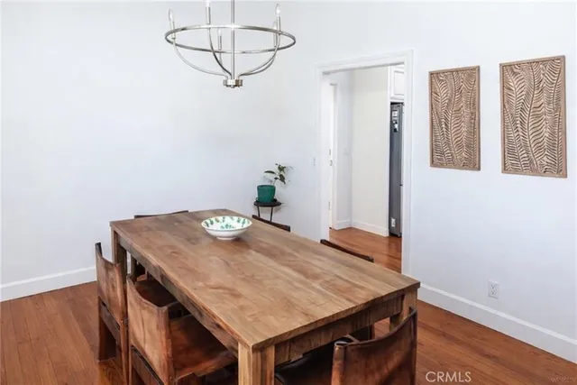 a dining room with a table and chairs