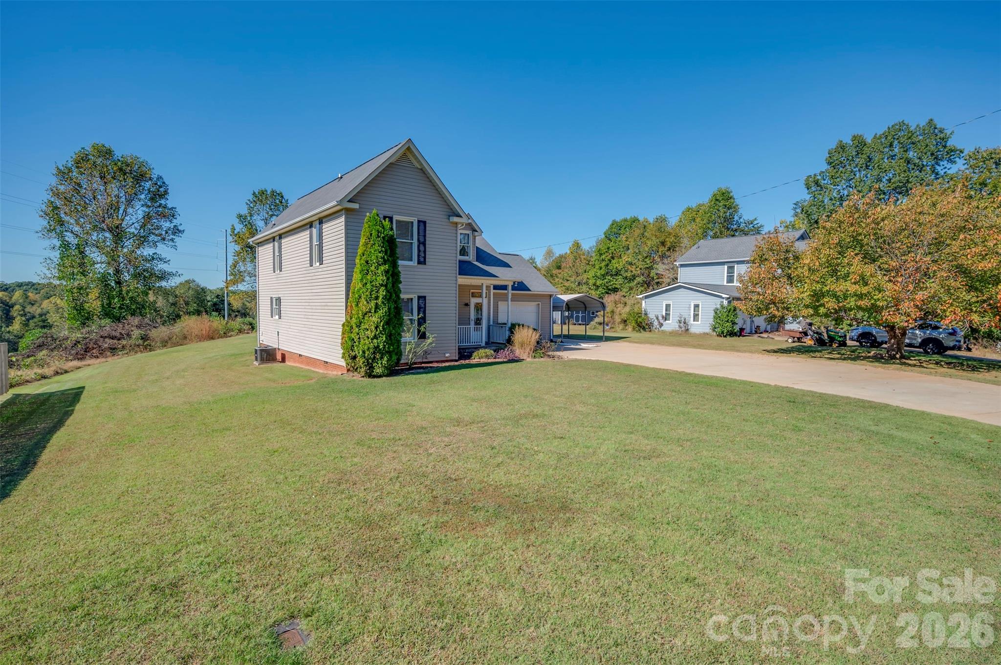 506 Pleasant Street Spindale, NC 28160 - Photo 31 of 42 a yellow house with trees in front of it
