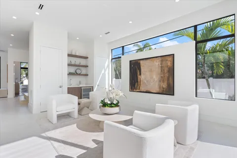 a bathroom with a tub a sink and a window