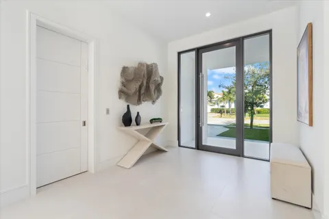a bathroom with a granite countertop sink mirror and toilet