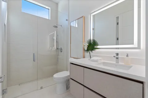 an empty room with wooden floor and sliding door