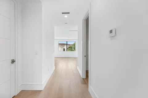 a view of an empty room with a sliding door