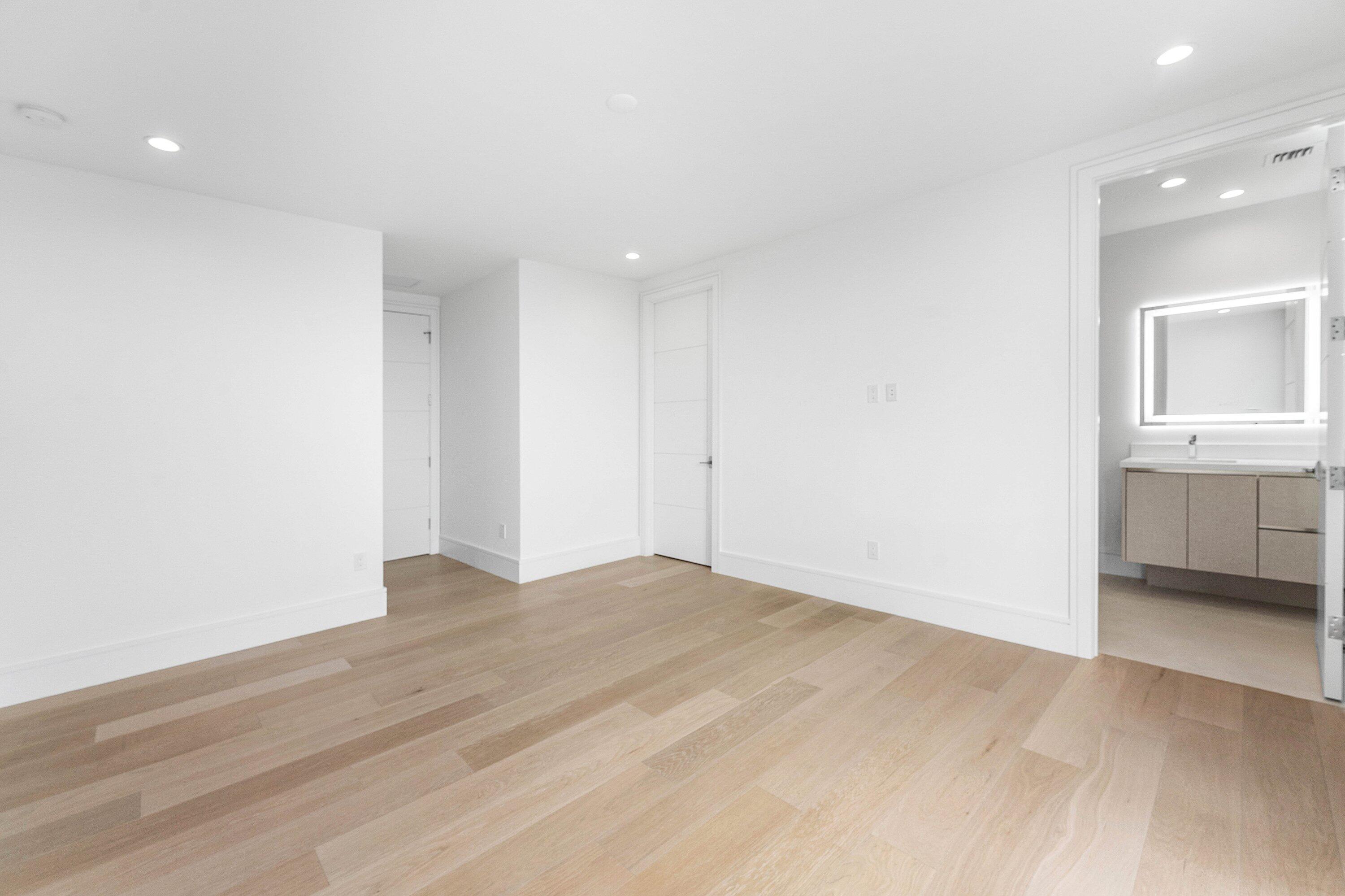 498 Northeast 6th Street Boca Raton, FL 33432 - Photo 33 of 60 a view of an empty room with wooden floor and a window
