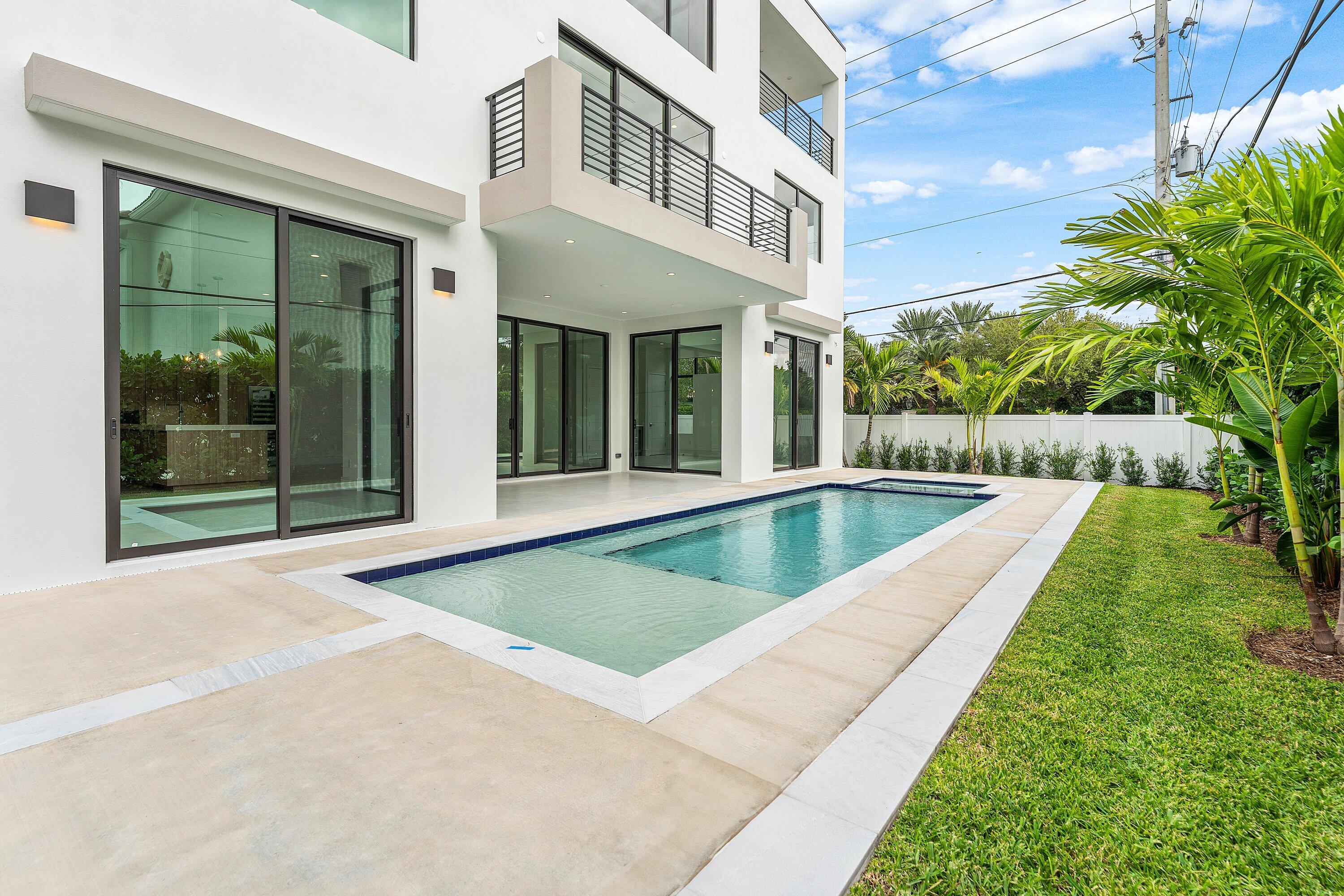 498 Northeast 6th Street Boca Raton, FL 33432 - Photo 46 of 60 a view of a house with a swimming pool