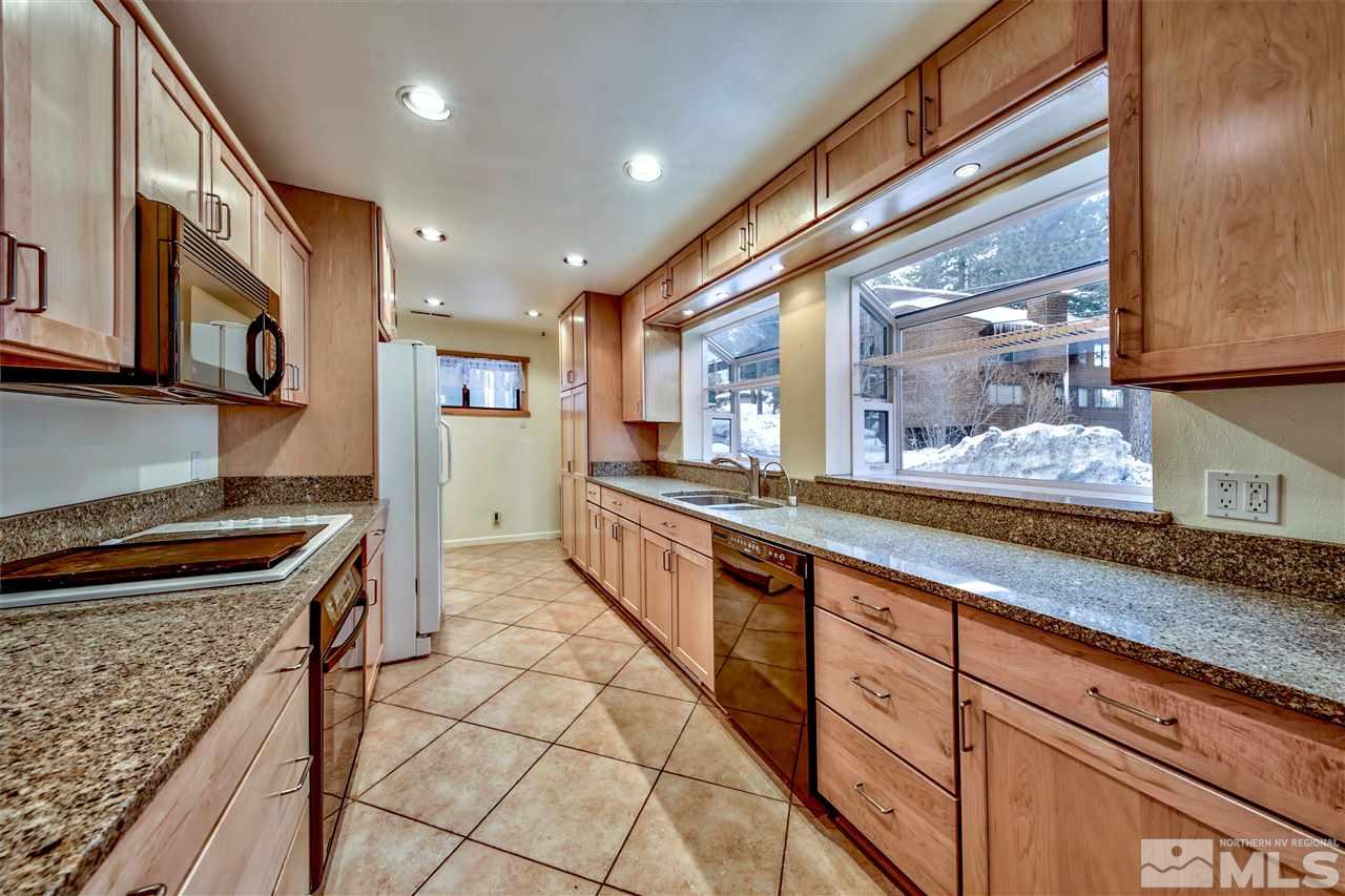 347 Cottonwood Court Incline Village, NV 89451 - Photo 13 of 25 a large kitchen with stainless steel appliances granite countertop a stove and a sink