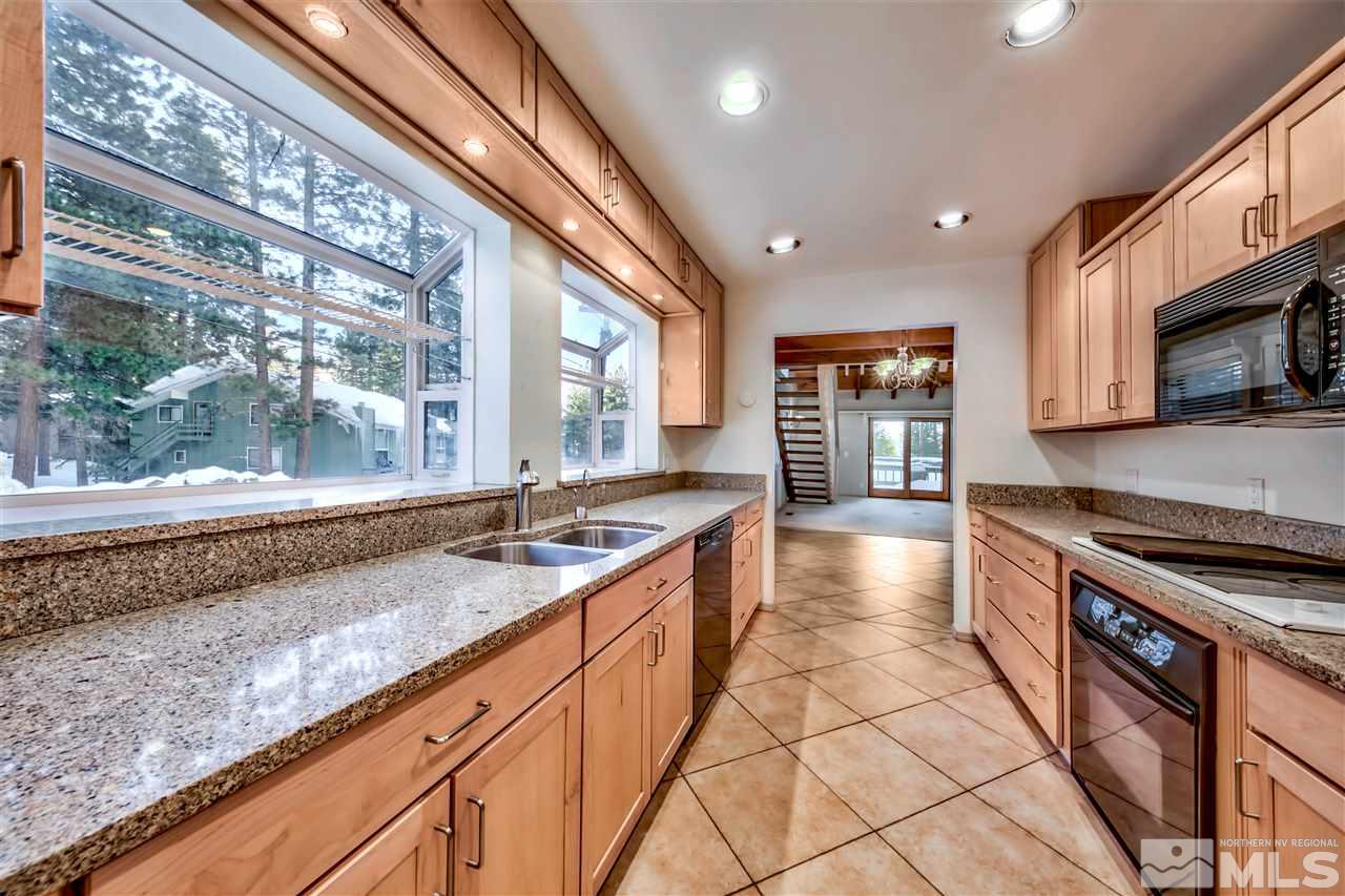 347 Cottonwood Court Incline Village, NV 89451 - Photo 14 of 25 a large kitchen with granite countertop a stove and a sink