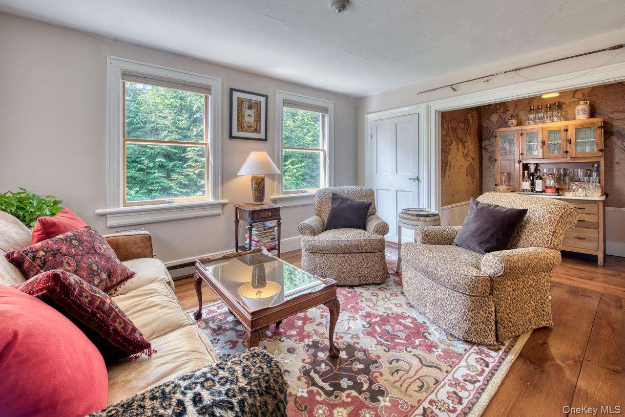 7635 Main Bayview Road Southold, NY 11971 - Photo 15 of 20 a living room with furniture and a window