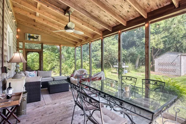 a bathroom with a shower sink and mirror
