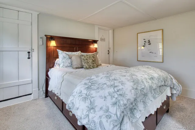 a living room with a fireplace and a wooden floor