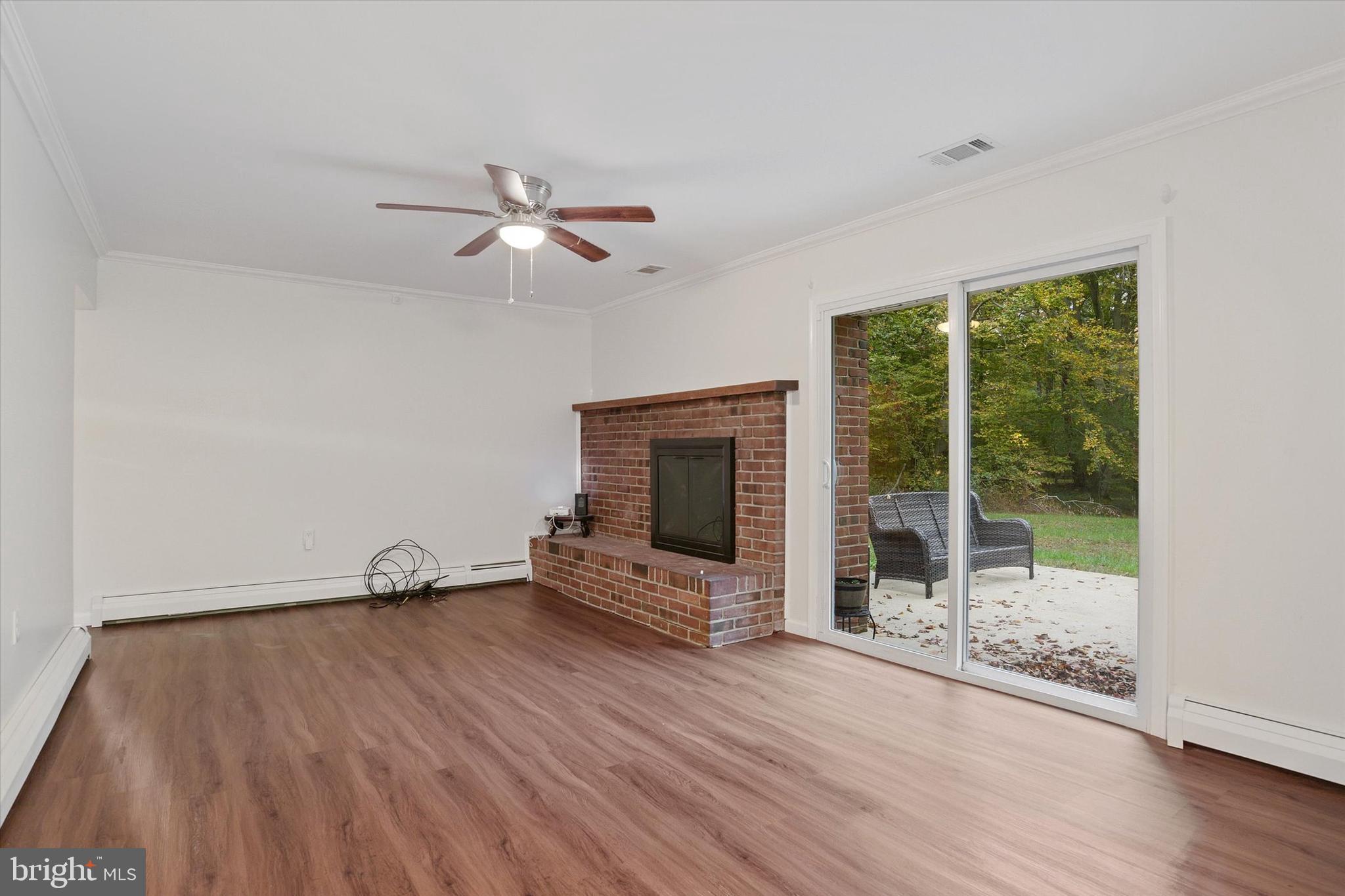 713 Gilbert Road Aberdeen, MD 21001 - Photo 8 of 25 Family room w/ fireplace and sliders to back yard!