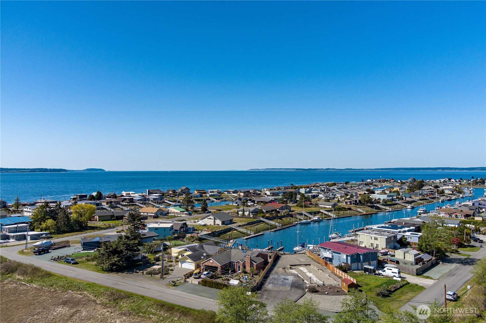 3544 South Smugglers Cove Road Greenbank, WA 98253 - Photo 18 of 23 an aerial view of a parking space and ocean view