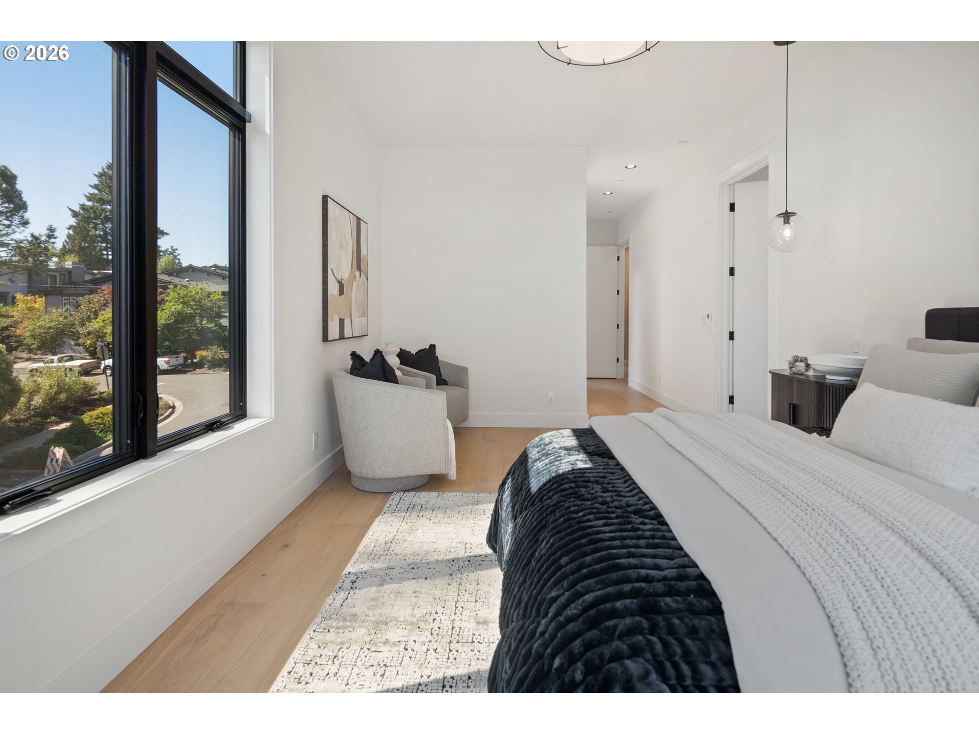 705 1st Street Lake Oswego, OR 97034 - Photo 18 of 35 a bedroom with a bed and a large window