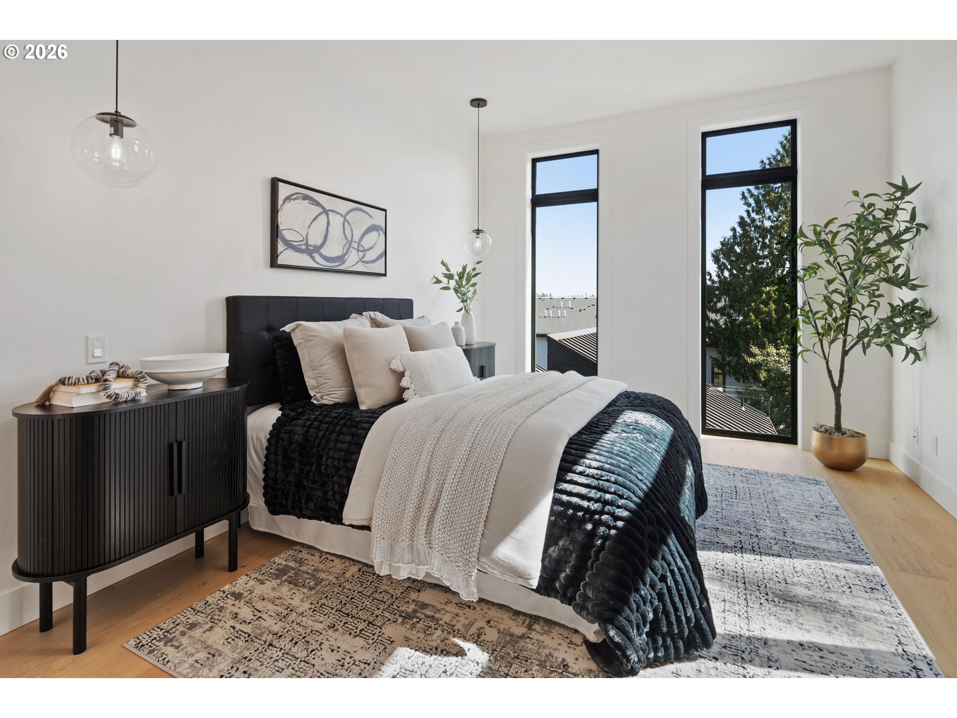 705 1st Street Lake Oswego, OR 97034 - Photo 20 of 35 a bedroom with a bed and a potted plant