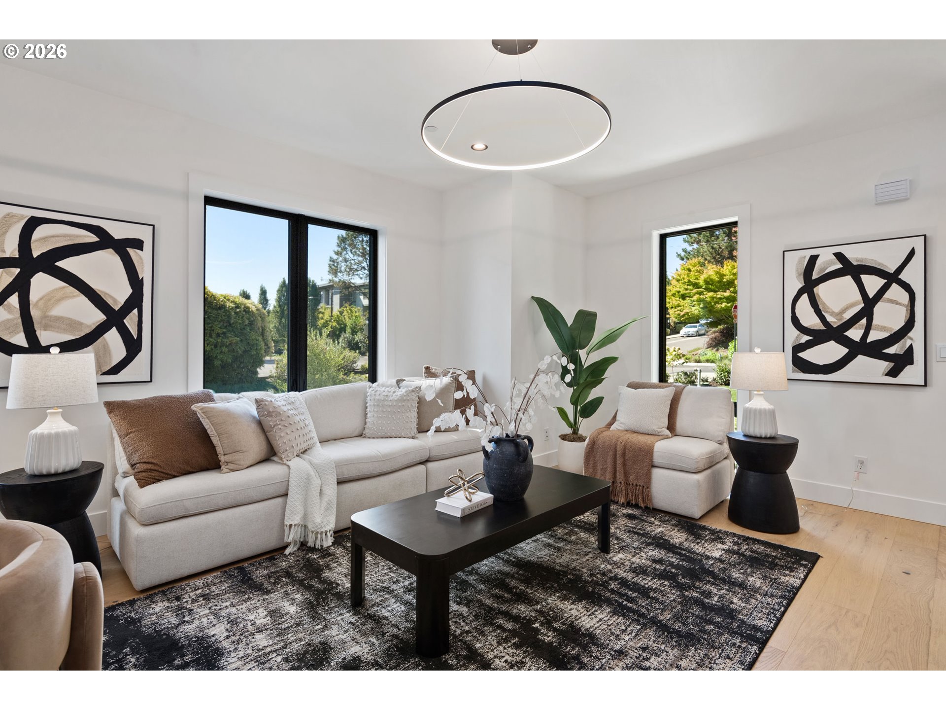 705 1st Street Lake Oswego, OR 97034 - Photo 4 of 35 a living room with furniture a rug and a large window