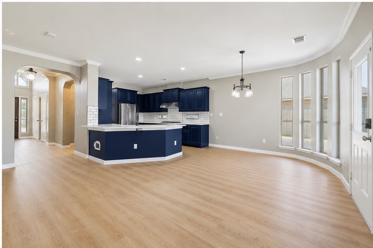 7324 Moon Rock Road Austin, TX 78739 - Photo 10 of 30 a view of kitchen with kitchen island wooden floor and center island