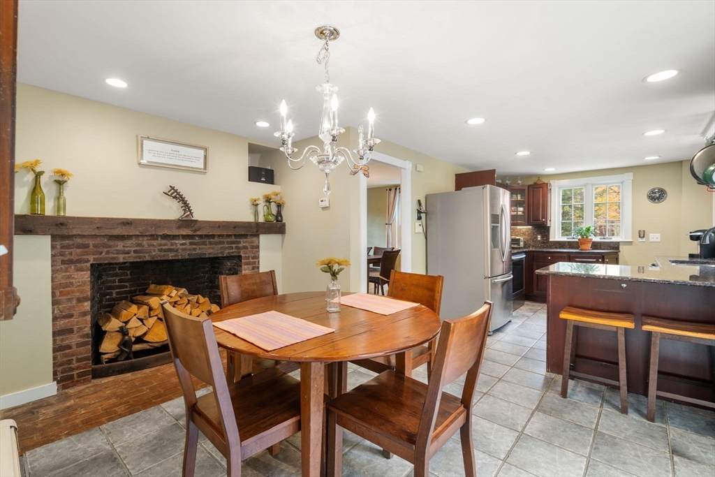 463 Edmands Road Framingham, MA 01701 - Photo 24 of 42 a dining table with chairs and kitchen view