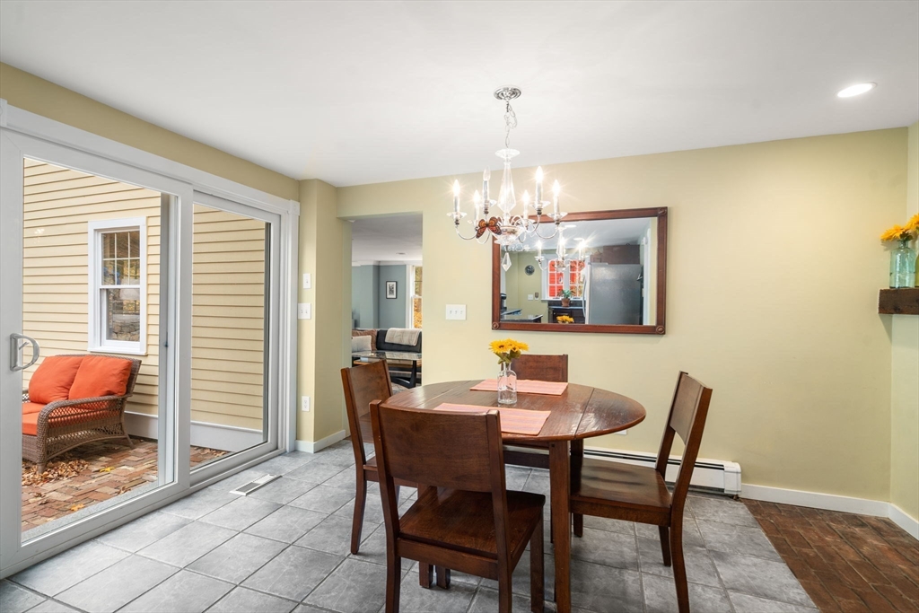 463 Edmands Road Framingham, MA 01701 - Photo 25 of 42 a view of a dining room with furniture and a chandelier