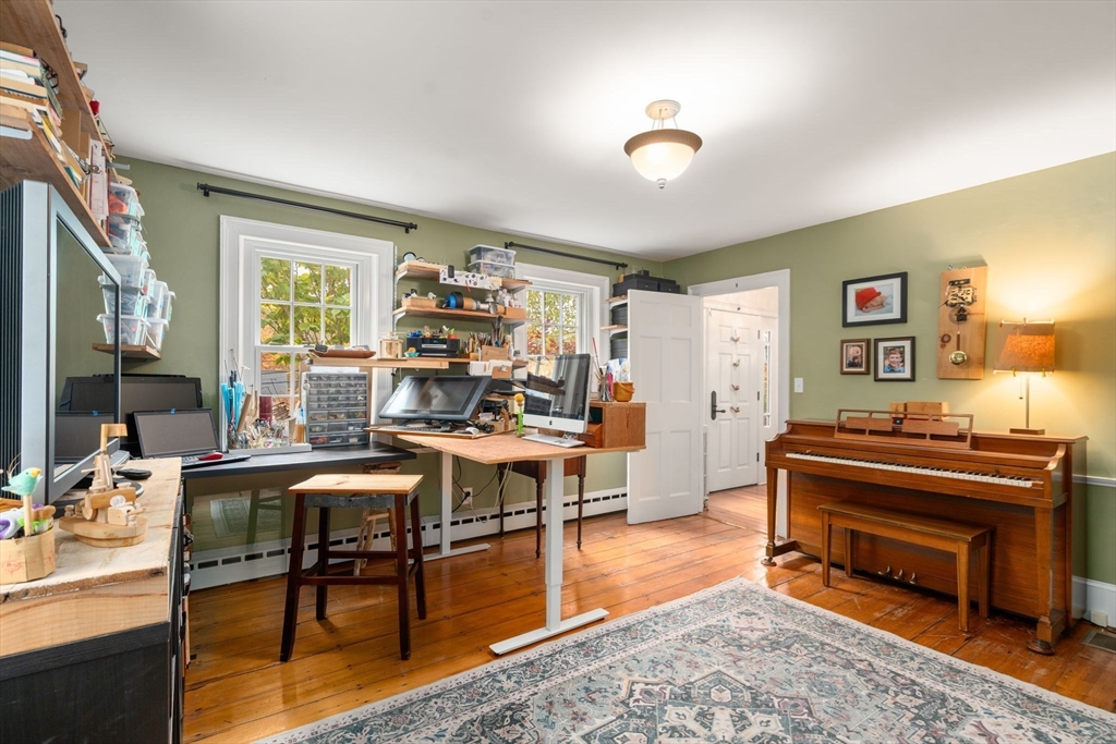 463 Edmands Road Framingham, MA 01701 - Photo 26 of 42 a workspace with furniture and a piano