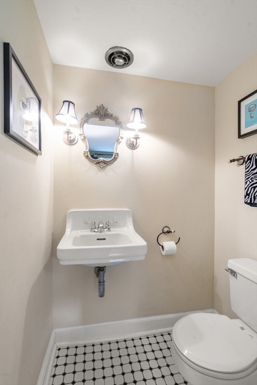 463 Edmands Road Framingham, MA 01701 - Photo 28 of 42 a bathroom with a sink a toilet and mirror