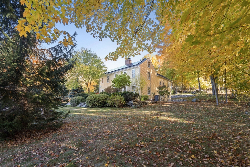 463 Edmands Road Framingham, MA 01701 - Photo 3 of 42 a view of a yard with plants and trees