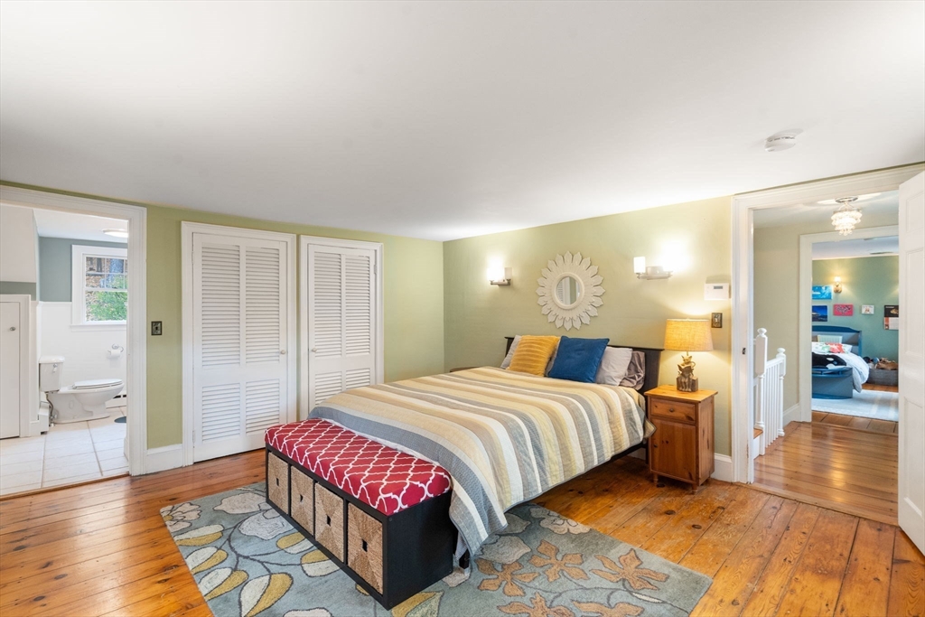 463 Edmands Road Framingham, MA 01701 - Photo 34 of 42 a bedroom with a bed and wooden floor