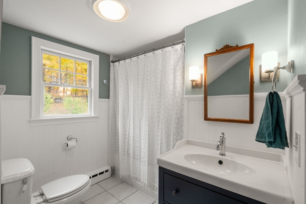 463 Edmands Road Framingham, MA 01701 - Photo 35 of 42 a bathroom with a sink and a mirror