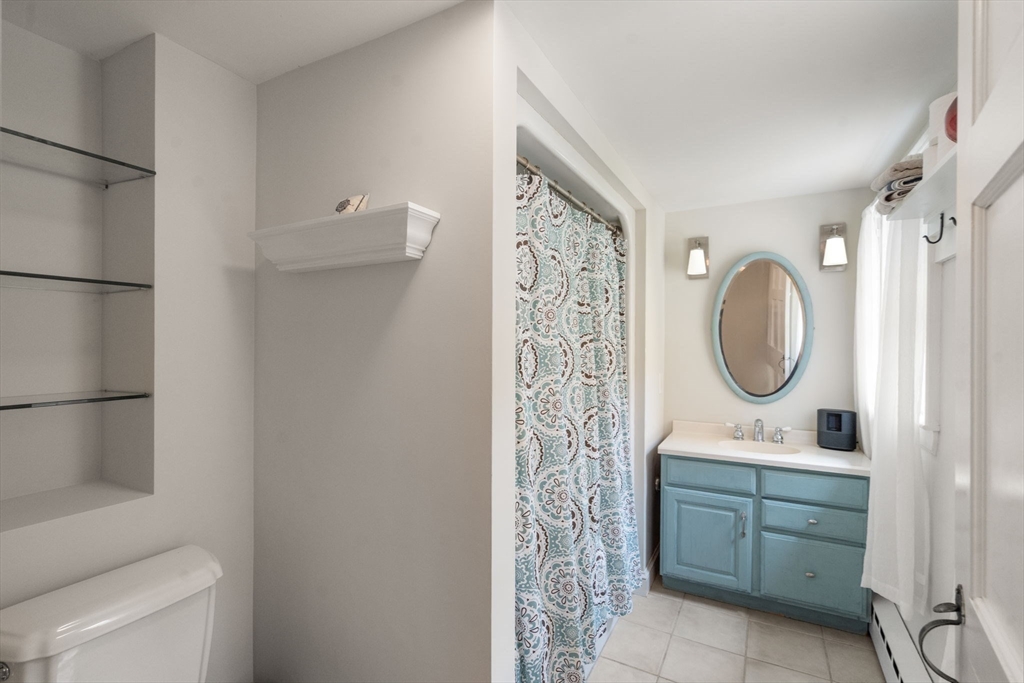 463 Edmands Road Framingham, MA 01701 - Photo 39 of 42 a bathroom with a sink a toilet and a mirror