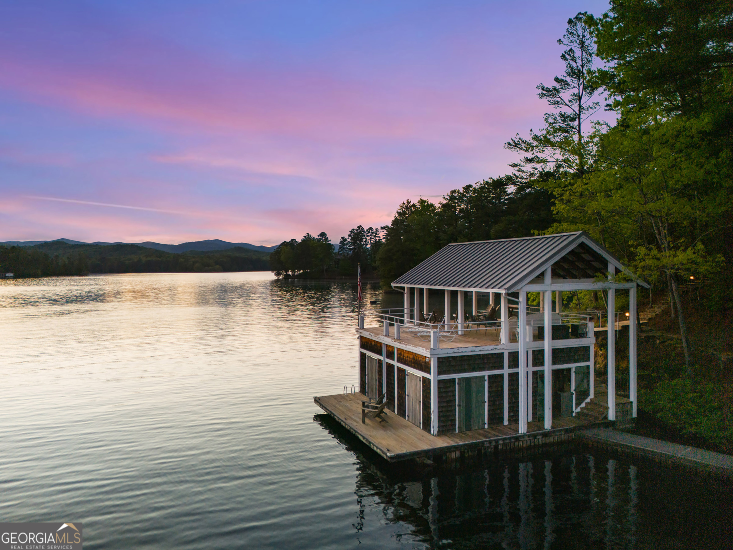a front view of a house with a lake view
