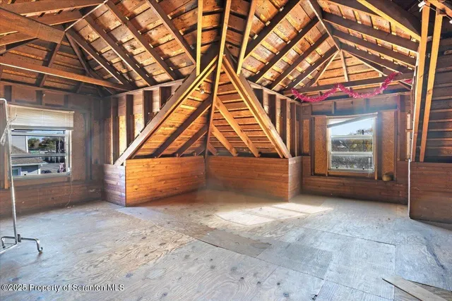 a view of an empty room with a fireplace