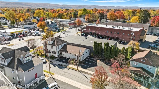 an aerial view of a house with a ocean view