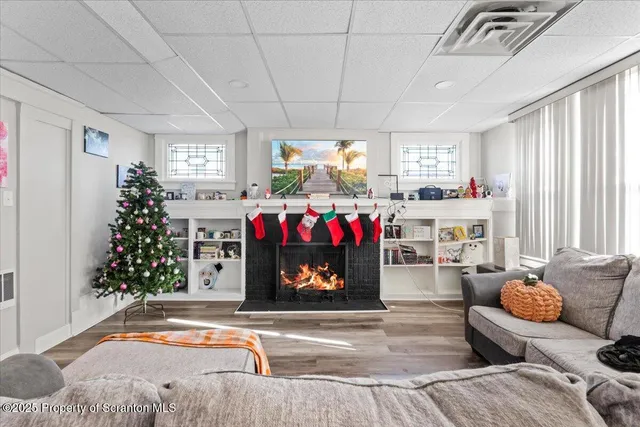 a living room with furniture and a fireplace