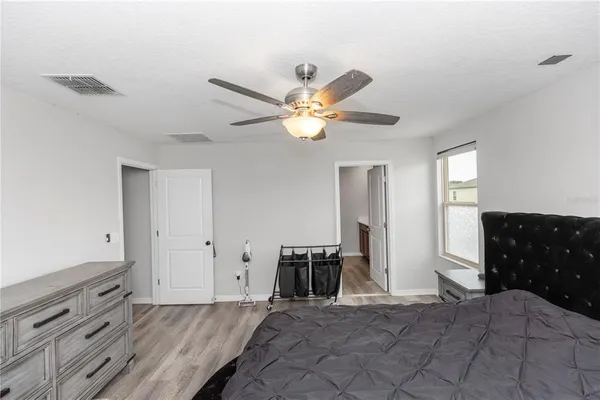 a view of livingroom with hardwood floor and ceiling fan