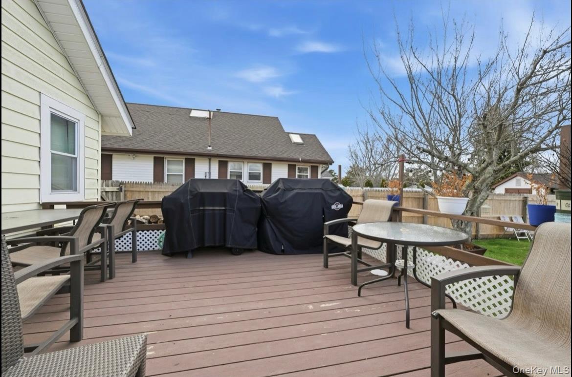 21 Locust Riverhead, NY 11901 - Photo 9 of 14 a front view of a house with outdoor seating