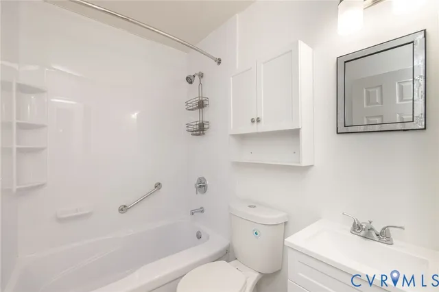 a bathroom with a toilet sink and bathtub