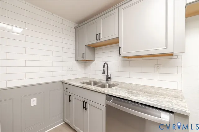 a kitchen with a sink and cabinets