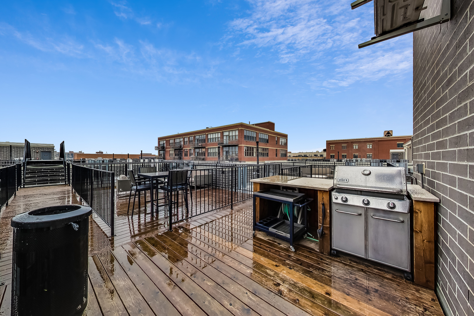 1247 West Madison Street, Unit 211 Chicago, IL 60607 - Photo 15 of 17 a view of a balcony with wooden floor and outdoor space