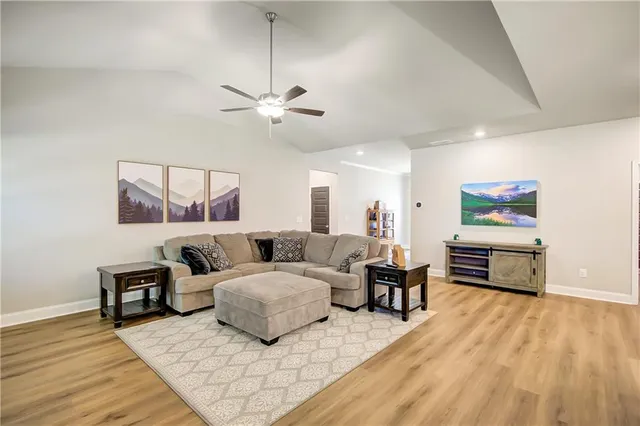a bedroom with furniture and a wooden floor