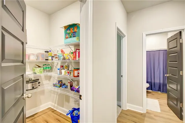 a room with a refrigerator and a cabinets