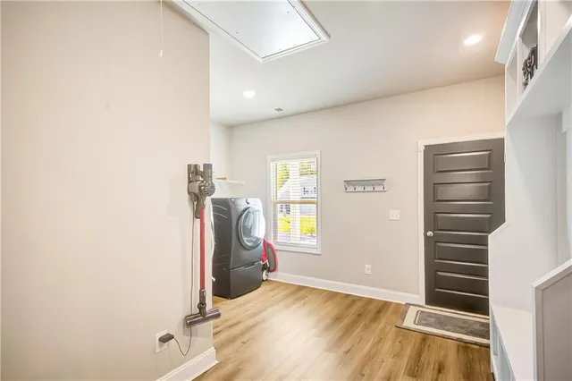a view of entryway with wooden floor