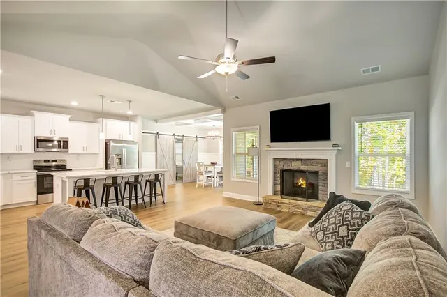 a living room with furniture and a fireplace