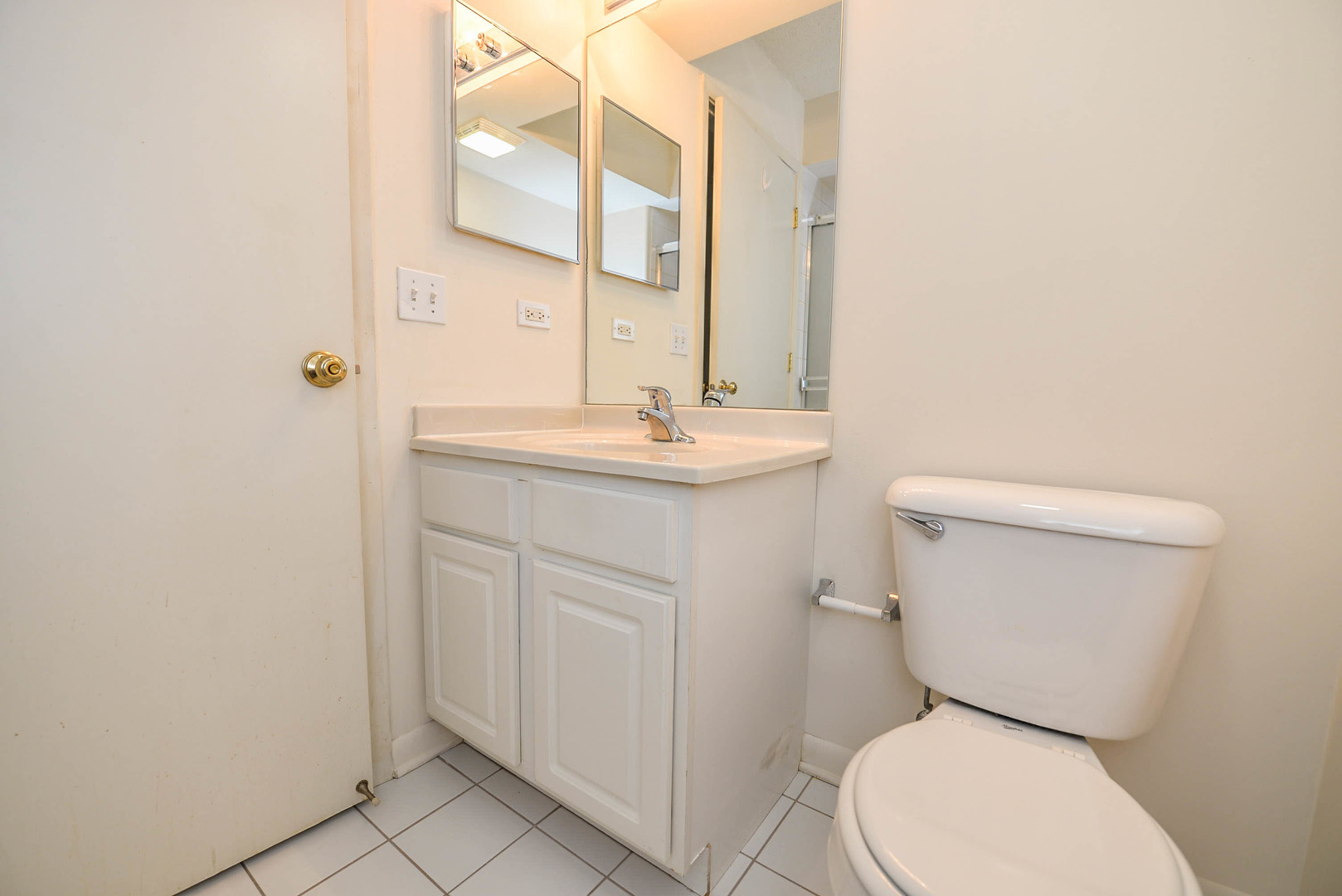 5337 North East River Road, Unit 302 Chicago, IL 60656 - Photo 14 of 22 a white toilet sitting next to a bathroom sink