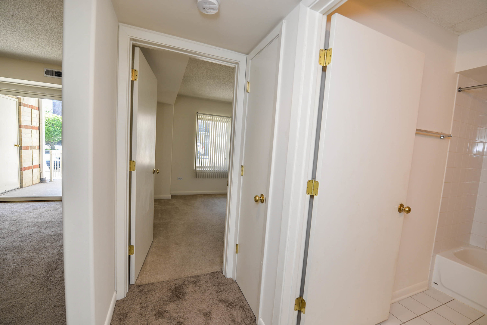 5337 North East River Road, Unit 302 Chicago, IL 60656 - Photo 19 of 22 a view of a bathroom from a hallway