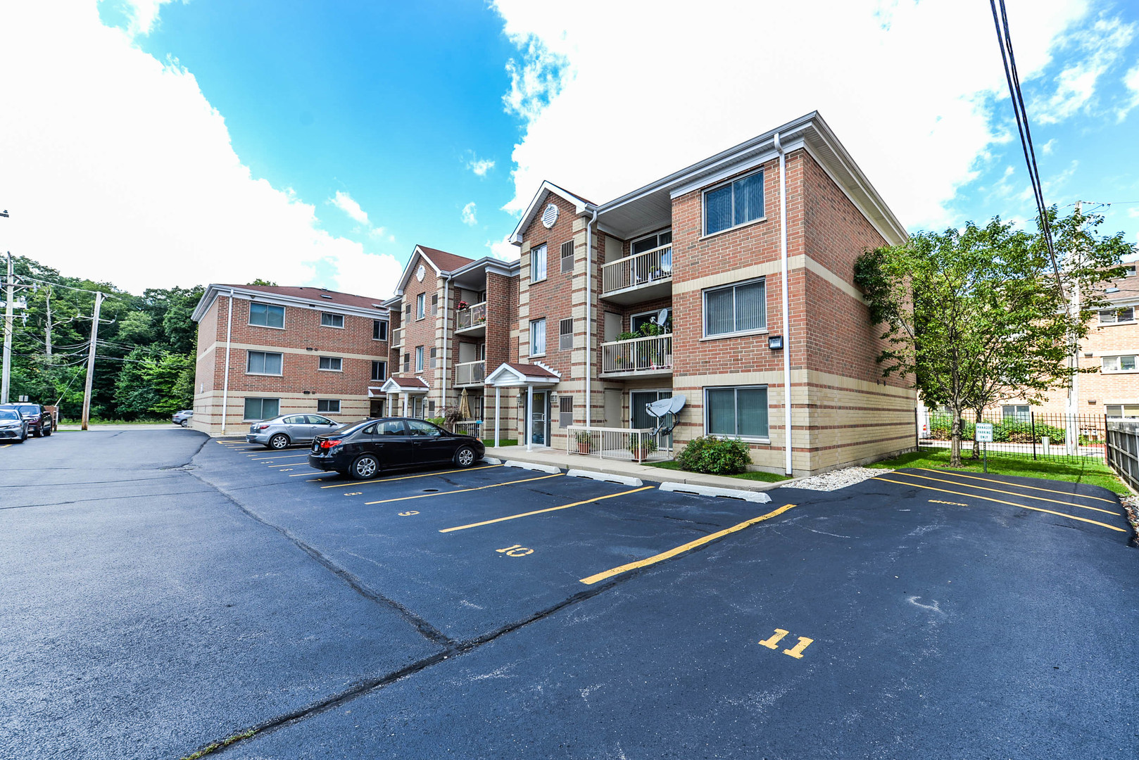 5337 North East River Road, Unit 302 Chicago, IL 60656 - Photo 20 of 22 a view of street with parked cars