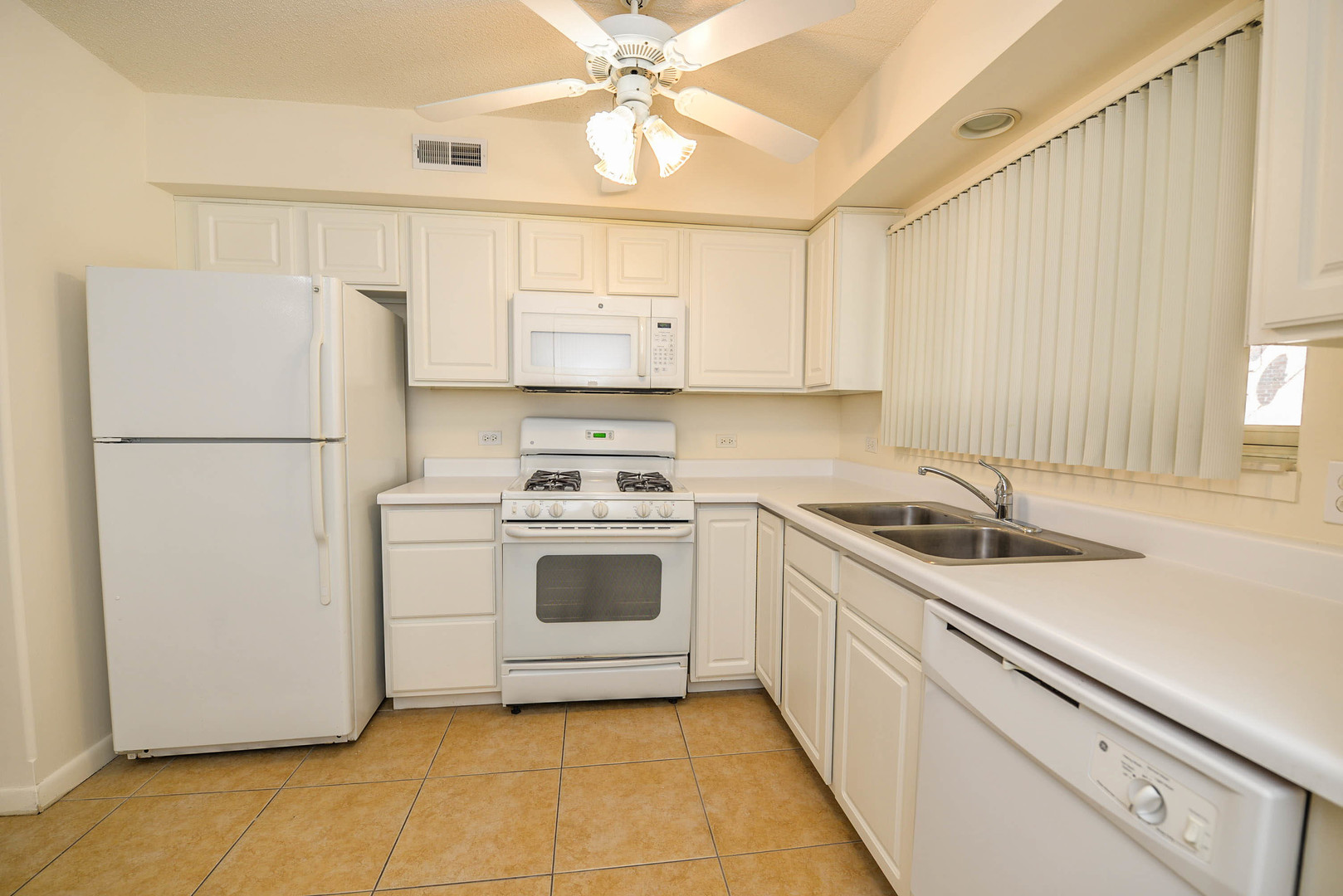 5337 North East River Road, Unit 302 Chicago, IL 60656 - Photo 3 of 22 a kitchen with a white stove top oven and refrigerator