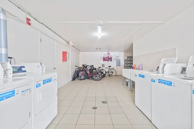 a kitchen with sink cabinets and appliances