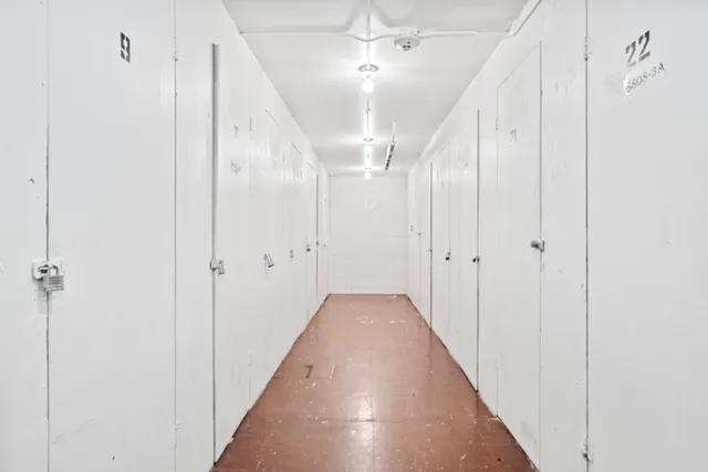 a view of a hallway with a white walls