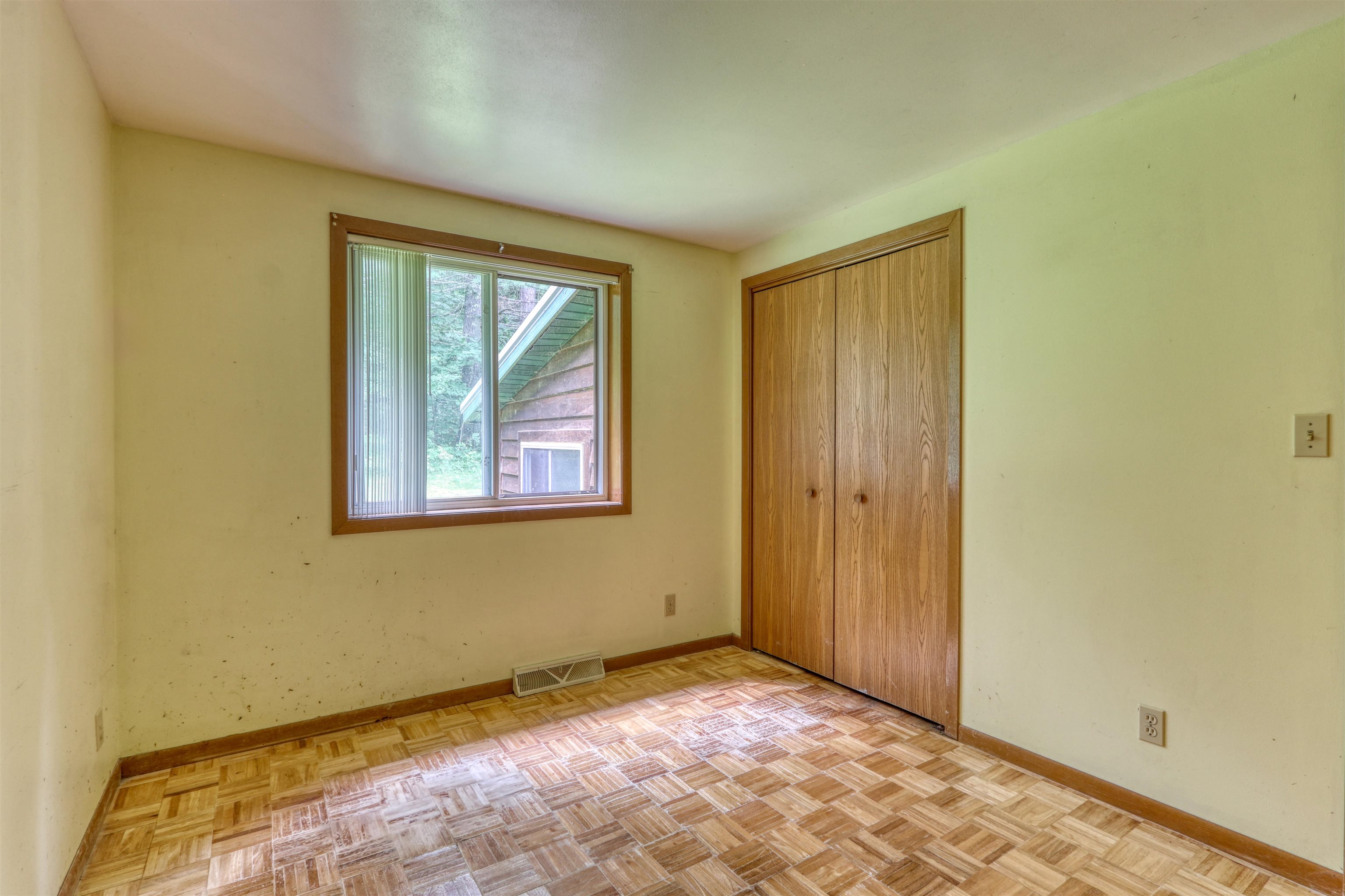 22655 Sunset Acres Lane Grand View, WI 54839 - Photo 21 of 47 Unfurnished bedroom with baseboards and a closet