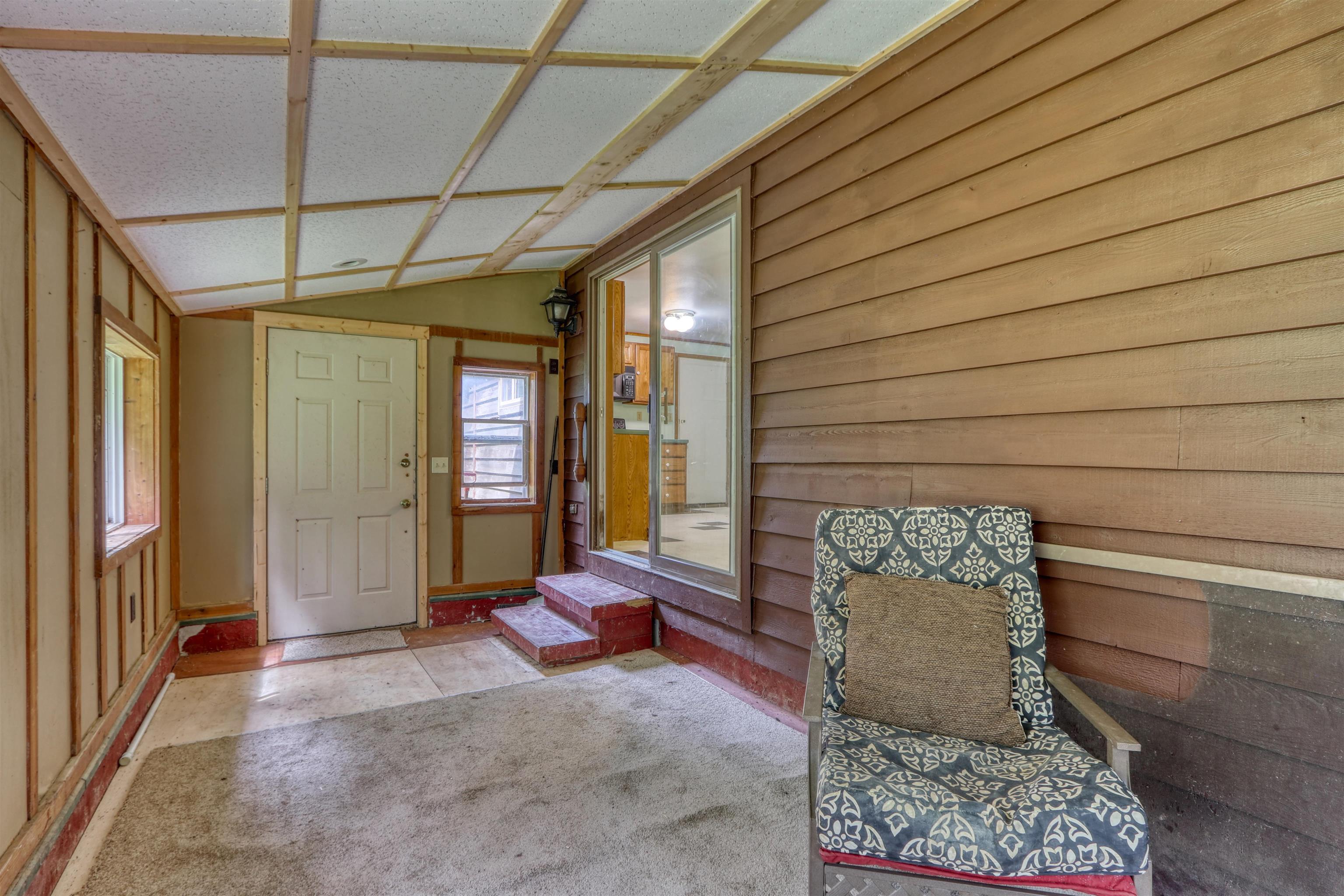 22655 Sunset Acres Lane Grand View, WI 54839 - Photo 24 of 47 Unfurnished sunroom featuring vaulted ceiling