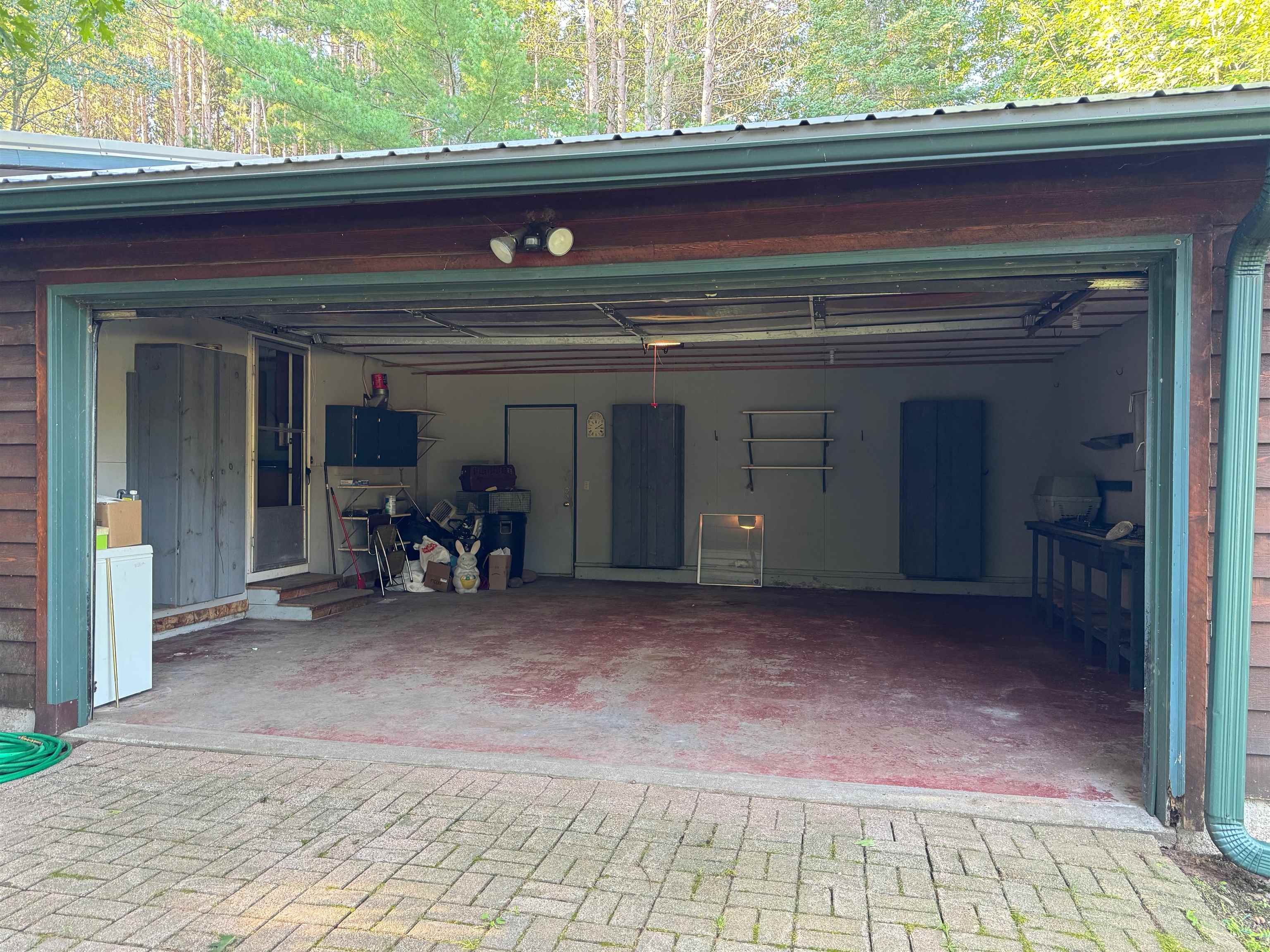 22655 Sunset Acres Lane Grand View, WI 54839 - Photo 26 of 47 Garage featuring decorative driveway