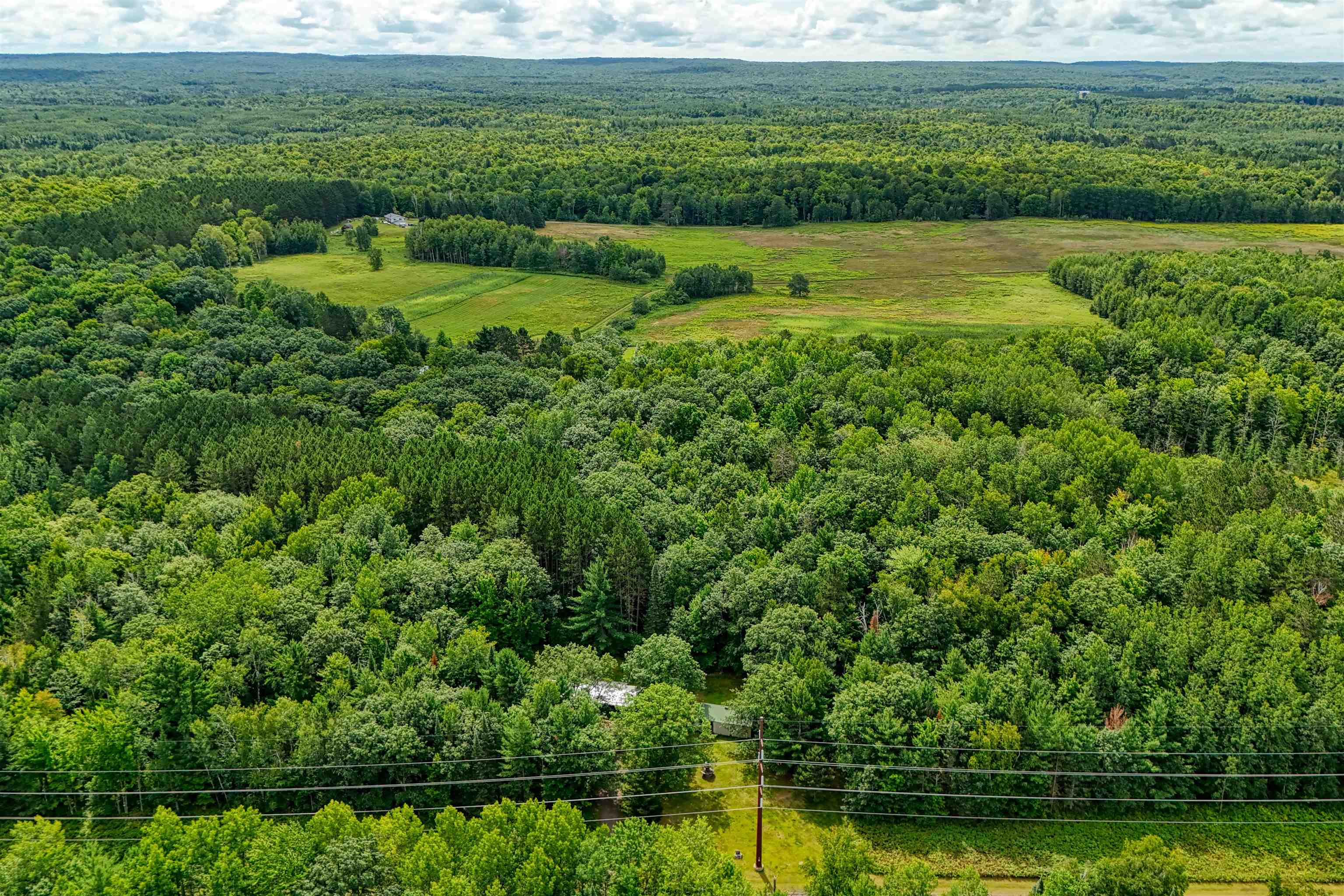 22655 Sunset Acres Lane Grand View, WI 54839 - Photo 3 of 47 Aerial view of a heavily wooded area